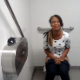 A humorous video featuring a pretty, black girl trying to take a shit at school without anybody hearing. Of course, this is fake and staged, but still nice to see her on the toilet.